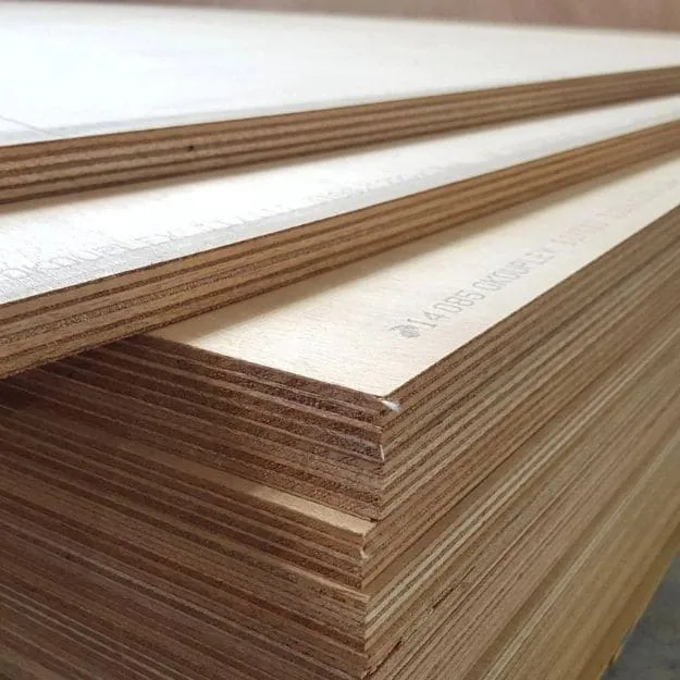Pale-faced plywood panels stacked with veneer layers visible along their edges.