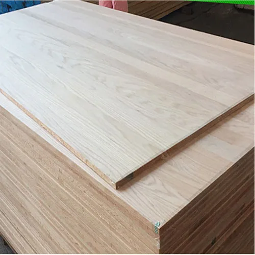 A light woodgrain panel resting on a brown panel stack, with the sheet edges visible.