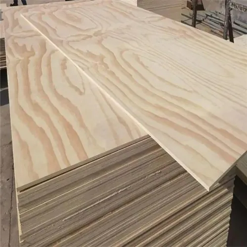 A pale plywood sheet with broad wavy wood grain, resting on a panel stack.