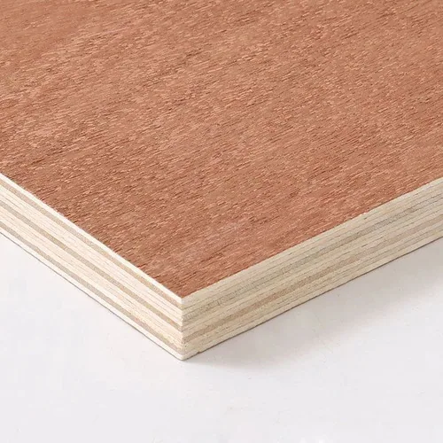 A reddish fine-grained plywood face with pale veneer layers visible at the corner.