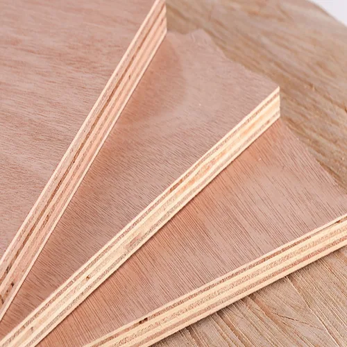 Overlapping reddish wood-faced plywood sheets with pale veneer layers visible at the edges.