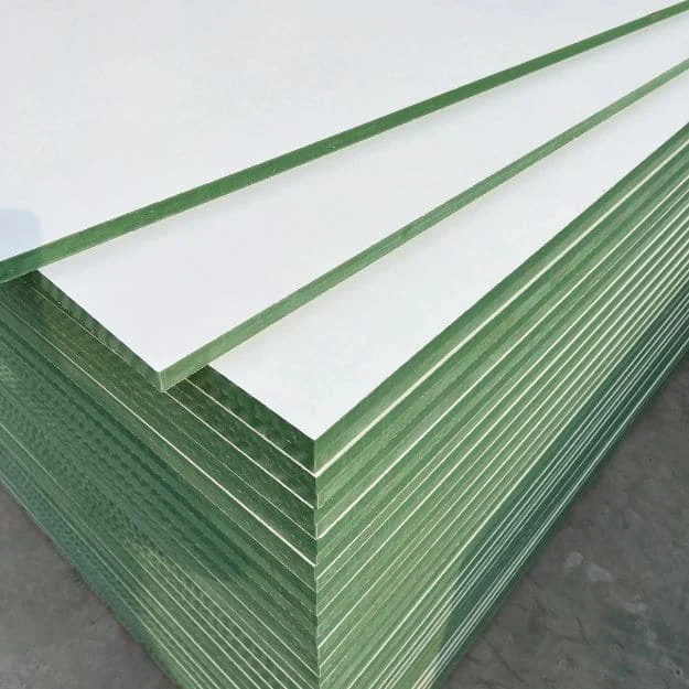 White melamine-faced moisture-resistant MDF boards with green-tinted core edges.